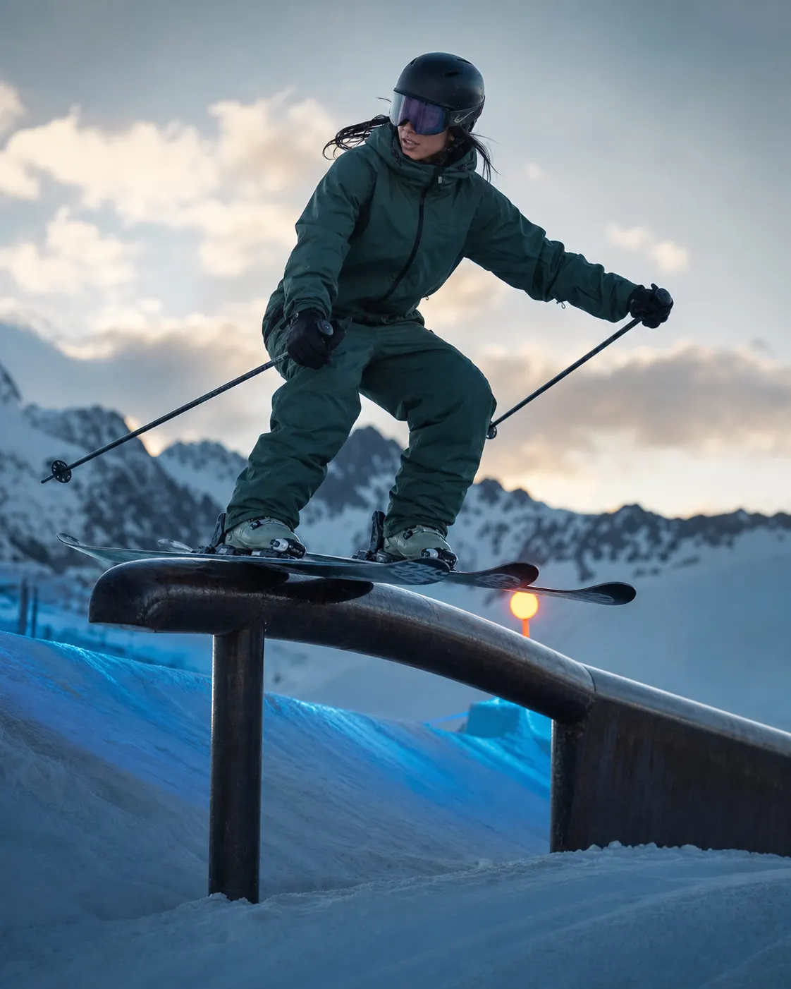 Talia Brooks transfers across a steel rail on the Frostline course.